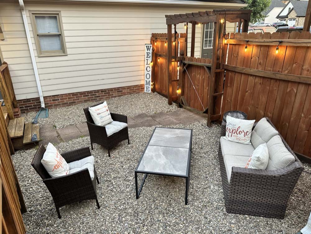Courtyard seating area at evening with string lights
