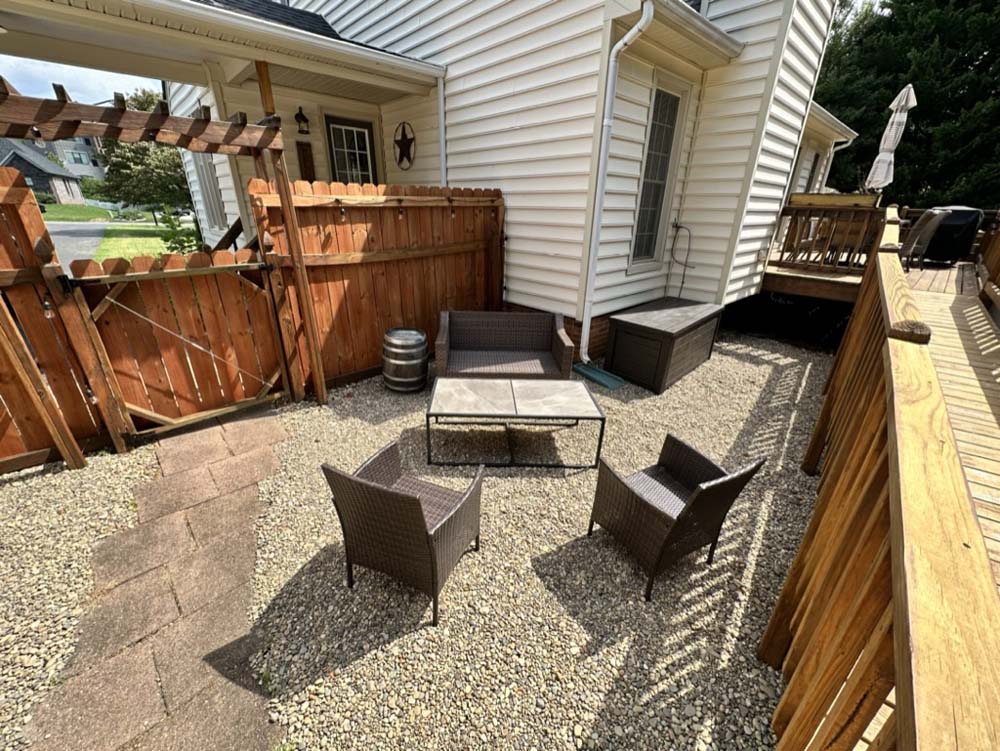 Courtyard patio with wicker chairs and coffee table