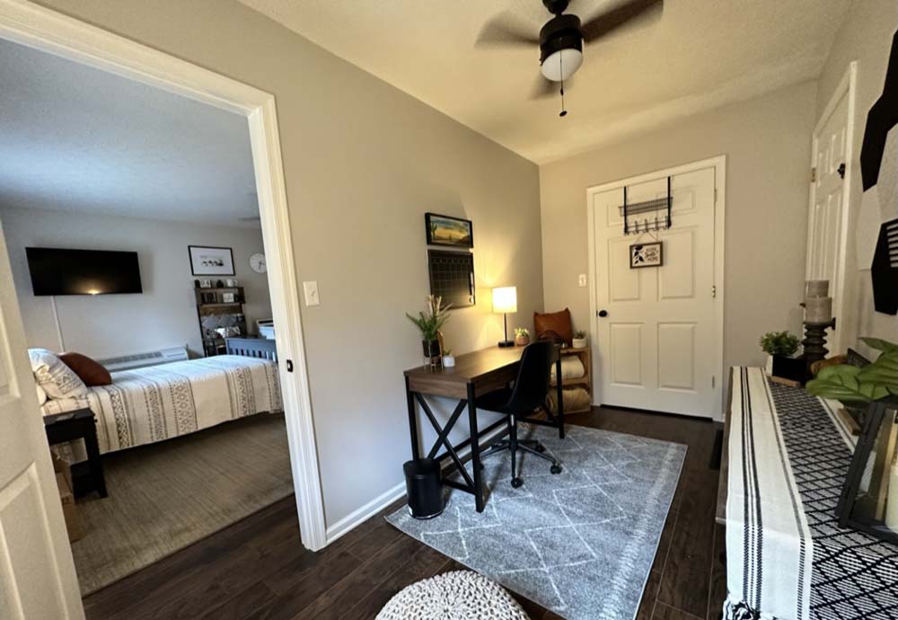 Office nook with desk and view into the bedroom