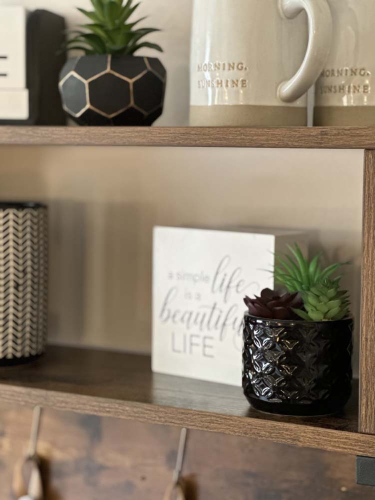 Close-up of Morning Sunshine mugs and ‘simple life’ sign